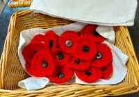 Basket of poppy brooches