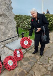 Hazel laying wreath at Westgate