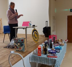 Margaret at the Quiz with raffle prizes