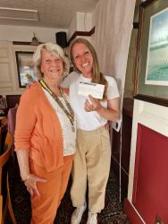 President Barbara presenting a cheque to Mama to Mama
