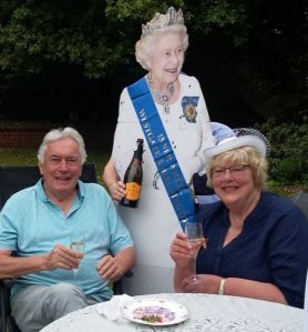 The Queen pours the champagne