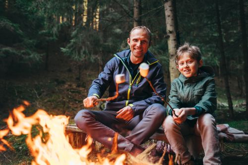 father and son at the campfire