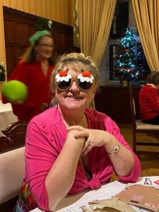 guest wearing her prize xmas pud glasses